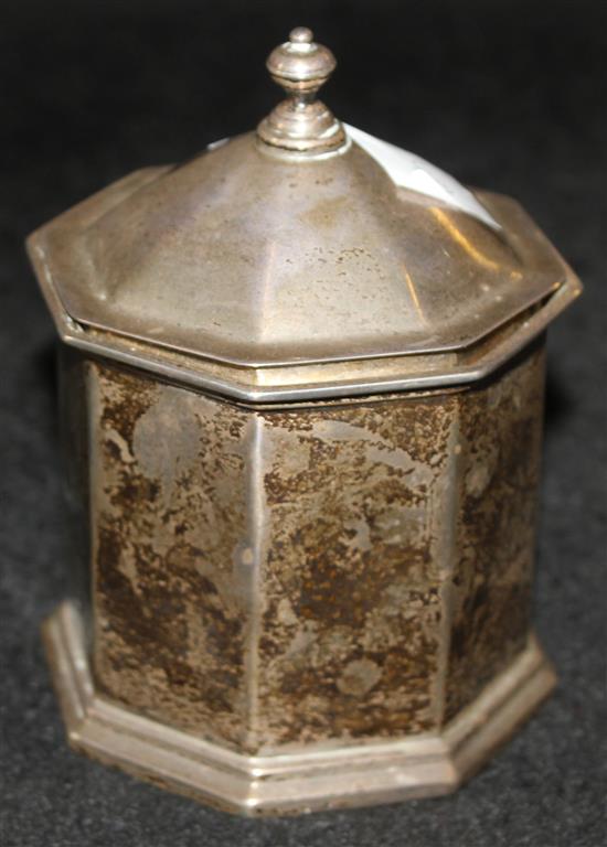 A silver octagonal tobacco jar and cover